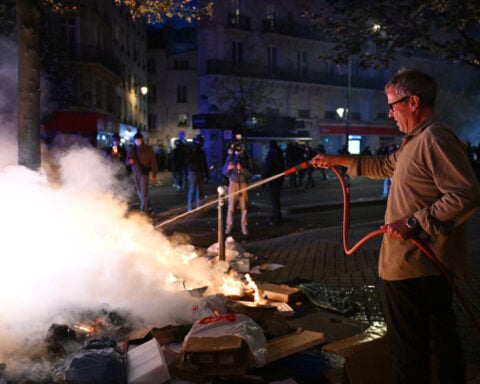 Macron condemns those who 'sought to bring down the Republic' after rioting mars nationwide protests