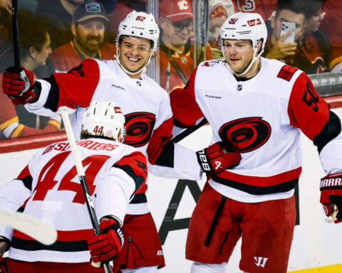 Sharangovich breaks late tie as the Flames end the Hurricanes' 7-game winning streak