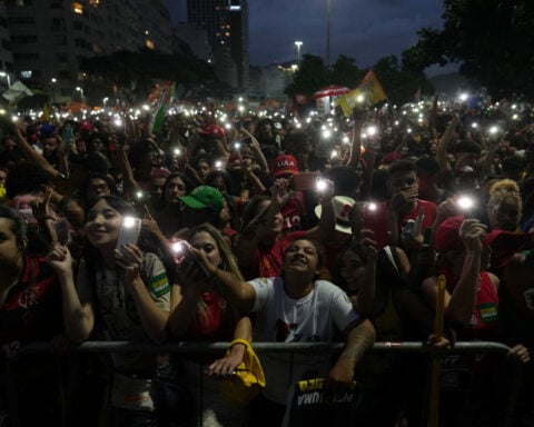 Brazil's Lula and Flávio Bolsonaro trade barbs in 1st debate only days before presidential runoff