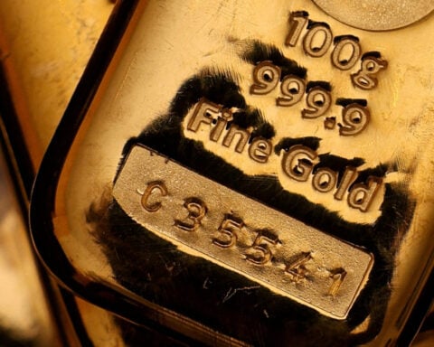 Gold edges lower as investors weigh Fed rate signals