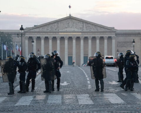 French bond yields dip but remain near 24-year high in volatile trading