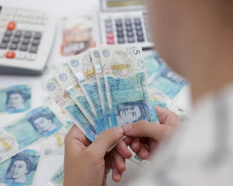 Pound edges higher, outperforming as investor nerves rattle euro zone markets 