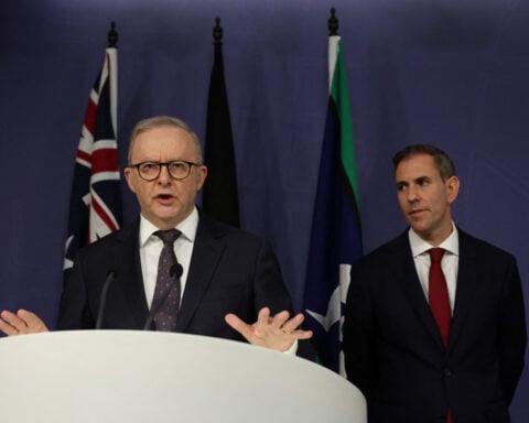Australia's treasurer warns of softer growth, higher unemployment