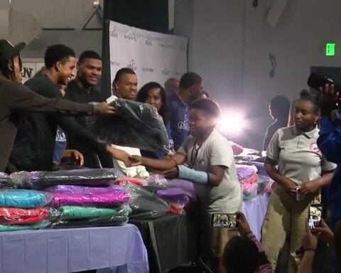 Nate Wiggins and Ja'Kobi Lane surprise Baltimore students with coats and autographs at school