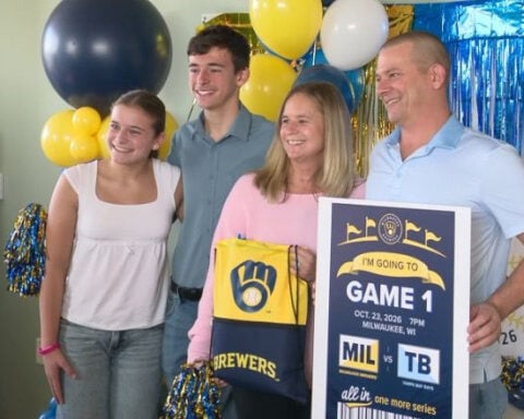 Wisconsin woman who beat cancer twice surprised with Game 1 World Series tickets