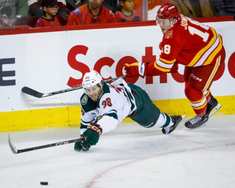 Cooley makes 36 saves in the Flames' 2-1 victory over the Wild
