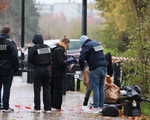 Macron says Paris suburb shooting that killed one person was terrorist and racist act