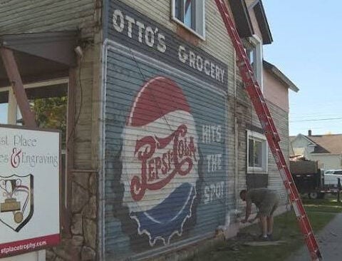 A sip of history: Pepsi mural uncovered on building's wall