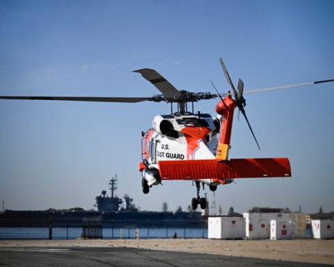 24-year-old Coast Guard swimmer says he fought waves and darkness to rescue 16 people from ocean