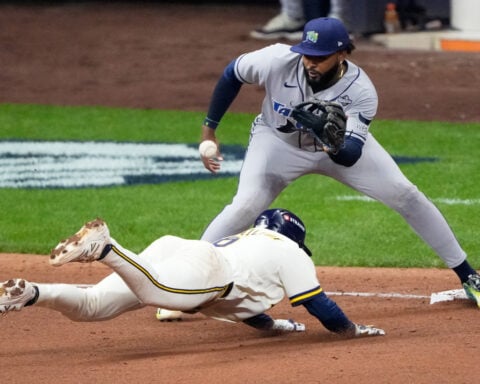 Balls glancing off gloves, runners thrown out trying to steal sink Rays in World Series opener