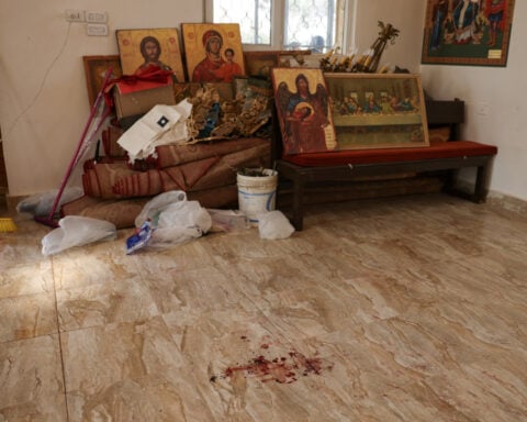 Jordan church attack survivor says assailant pointed handgun at him