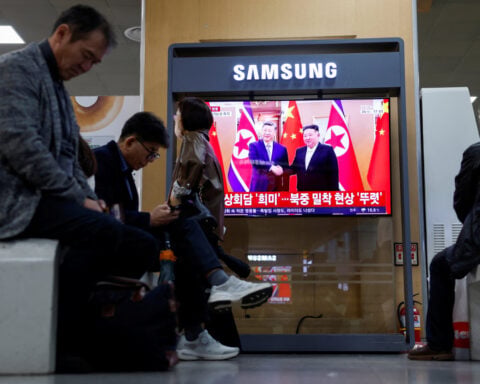 North Korea's Kim crosses new bridge into China as trade ties warm