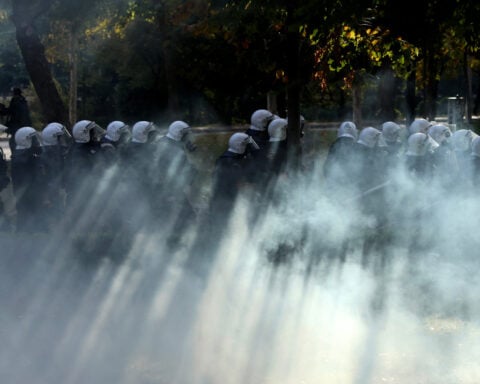 Soldiers guard center of Milan as thousands of protesters march in cities across Europe