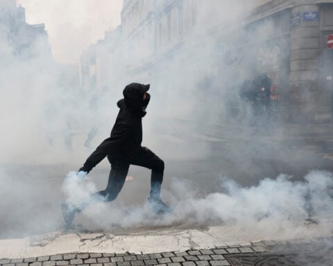 More than 400,000 protest across France, challenging Macron as Paris clashes erupt