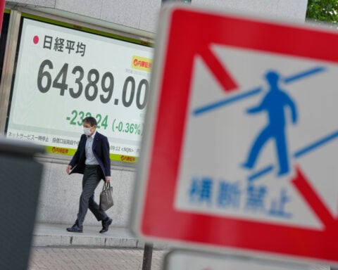 Shares fall in Asia after a decline on Wall Street, and oil prices fall more than 1%