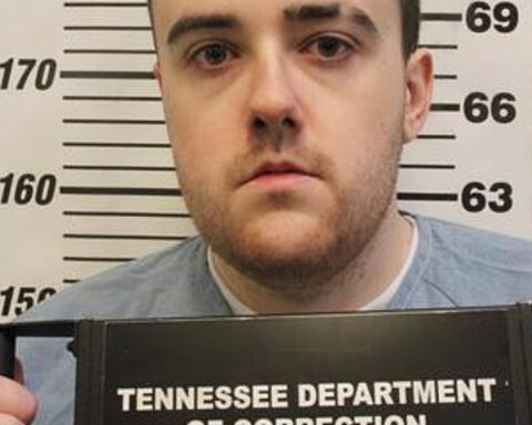 Man serving a life sentence for murder slips through a fence and escapes a Tennessee prison