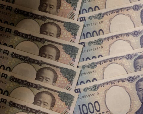Yen eases on risk-on mood ahead of central bank bonanza