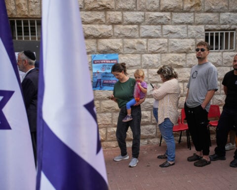 The Latest: Israelis vote in a tense election seen as a referendum on Netanyahu