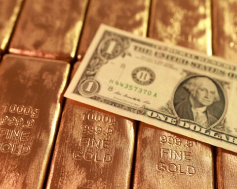 Strong dollar, high yields drag on gold outlook, but central-bank demand lends support