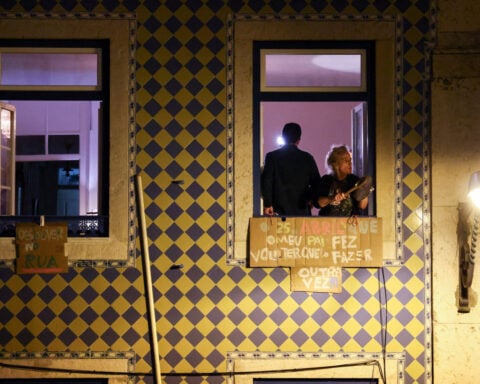 Thousands rally outside Portugal's parliament over housing crisis, police operations