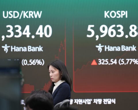 Shares in Asia rise after a rally on Wall Street, and oil prices gain more than 1%