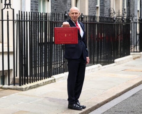 In first budget, UK's Healey tries to shelter households from economic storms