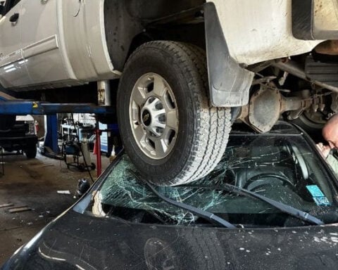 Car crashes into City of Pittsburgh garage in Strip District, gets stuck under hoist