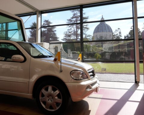 A popemobile exhibition is unveiled at the Vatican, featuring the vehicle popes have used since 1930