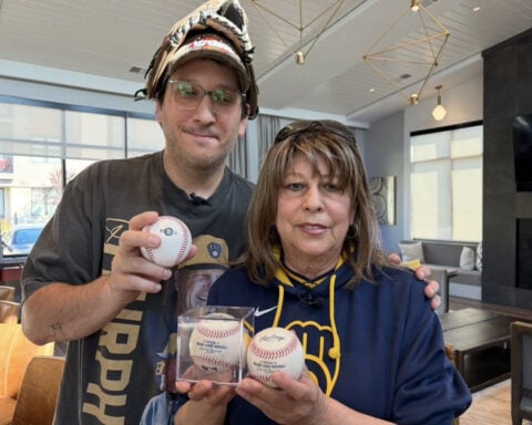 500 baseballs later, Mother and son take their tradition to the World Series