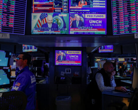 Wall Street ends higher as Fed holds key rate steady, focus turns to earnings