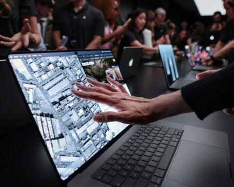 Apple shows pricey touchscreen laptops, a first for the iPhone maker