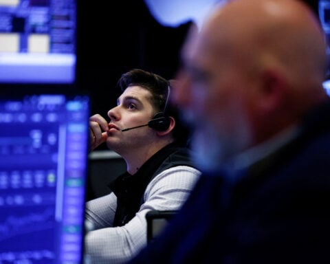 Global stocks hold gains after Fed decision, oil prices rise
