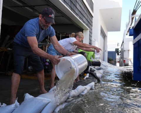 King tides inundate streets and flood homes and businesses along both US coasts