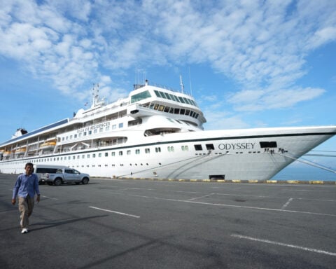 A US cruise ship suspends a global voyage in Asia due to fuel costs, stranding 200 passengers