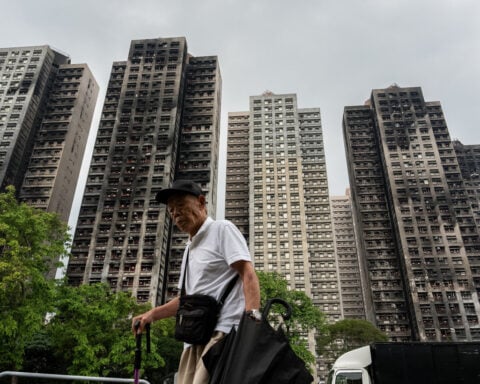 Hong Kong's housing minister resigns after fire investigation finds inadequate oversight