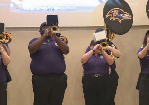 Baltimore Ravens alumni celebrate breast cancer survivors with a tailgate party