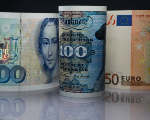 Euro edges up versus dollar after ECB holds rates
