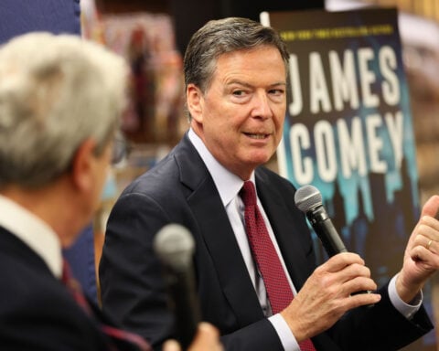 Justice Department tells judge it may bring more charges against James Comey