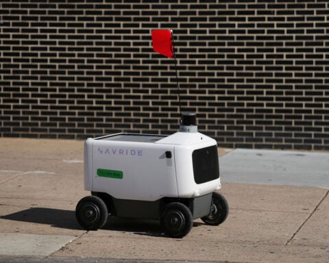 This retired professor was arrested for blocking a delivery robot. She says she’ll do it again